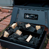 A black Masterbuilt Digital Charcoal Smoker with a glass window door, digital control panel, and wheels for mobility.
